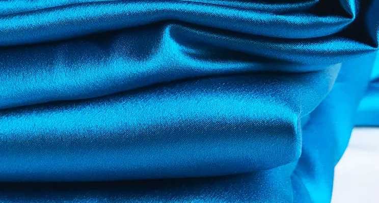 Navy silk crepe de chine fabric detail with deep matte color