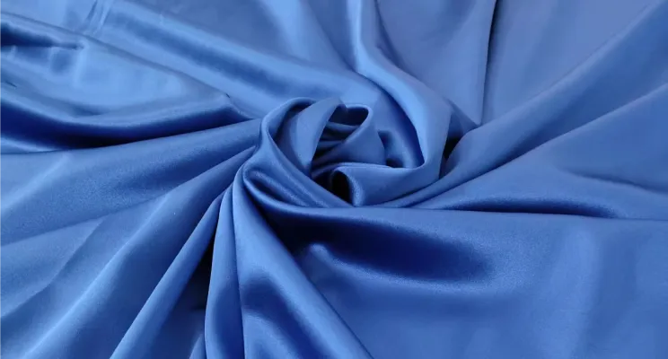 Navy blue stretch silk fabric close-up with rich depth