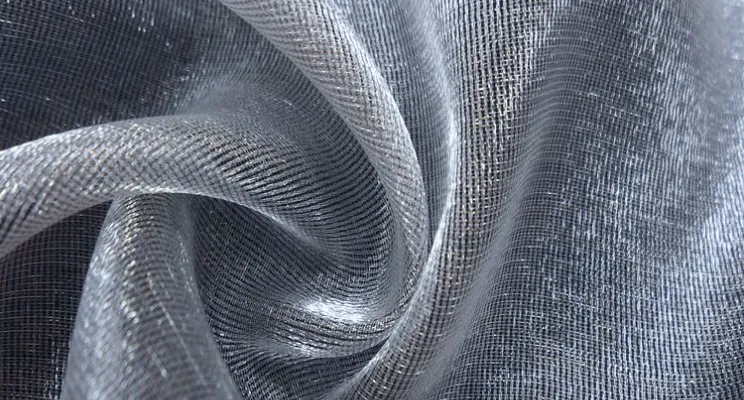 Silver metallic silk organza fabric close-up