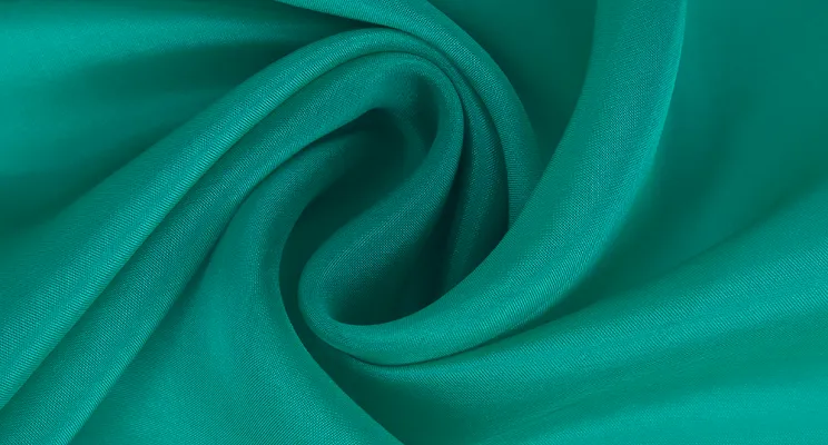 Teal silk viscose fabric with rich jewel tone