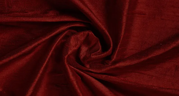 Red silk dupioni fabric showing saturated color on texture