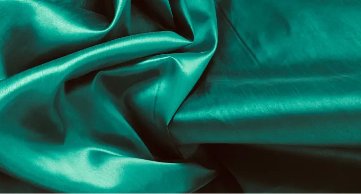 Green silk cotton fabric detail with natural depth