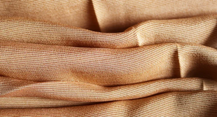 Camel silk wool fabric close-up with natural warmth