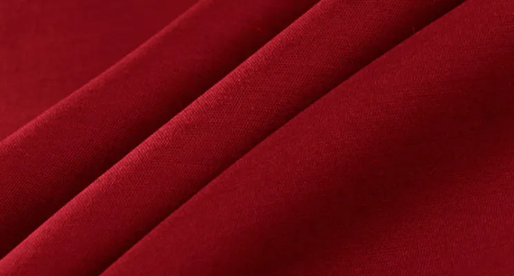 Burgundy silk wool fabric detail with deep color