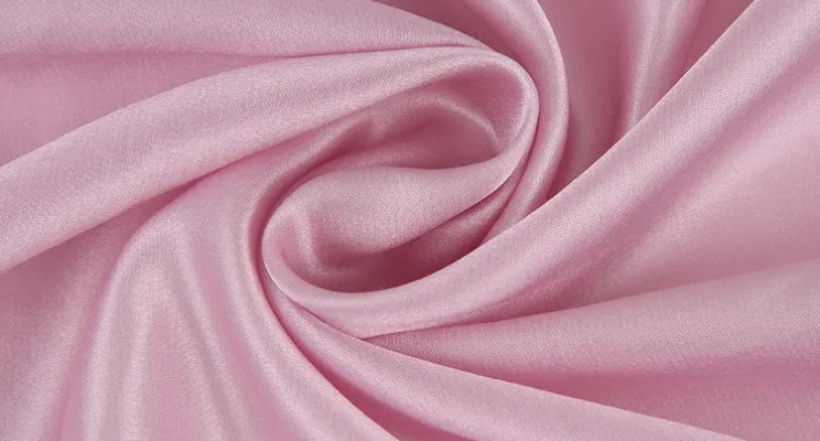 Pink silk cotton fabric close-up with gentle sheen