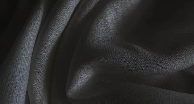 Black silk wool fabric with warm structured texture