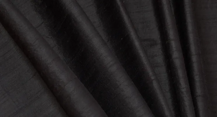 Black silk dupioni fabric showing natural slubbed texture