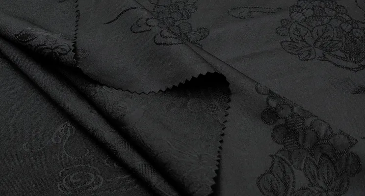 Black silk jacquard fabric with tone-on-tone woven motif
