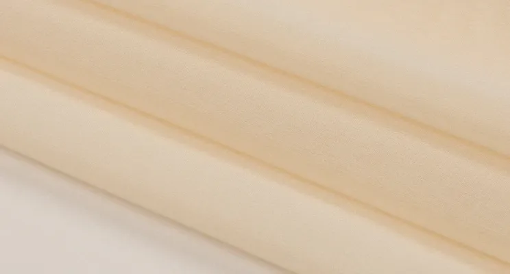 Off white silk organza fabric swatch in warm cream